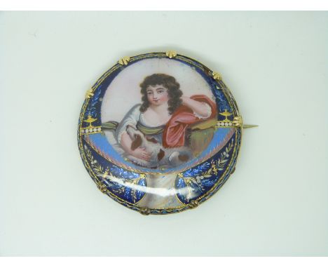 A 19thC brooch set with a portrait in enamel on a copper ground depicting a young woman with a Springer Spaniel, 5cm
