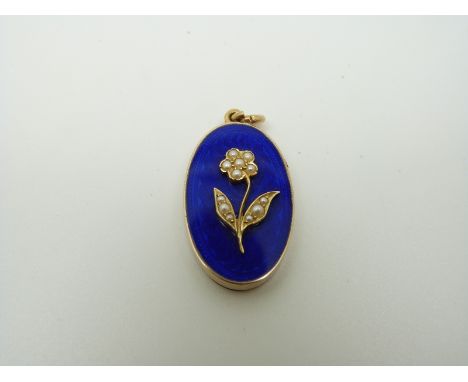 A Victorian oval pendant, the guilloché enamel ground with flower to the centre set with seed pearls, verso a glass compartme