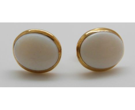 A pair of 14ct gold earrings set with an opal to each 