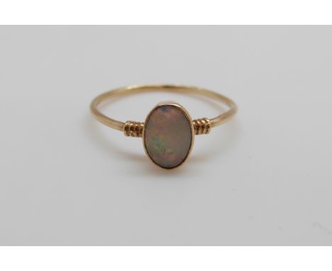 A 9ct gold ring set with an opal cabouchon (size J)