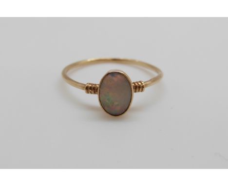 A 9ct gold ring set with an opal cabouchon (size J)