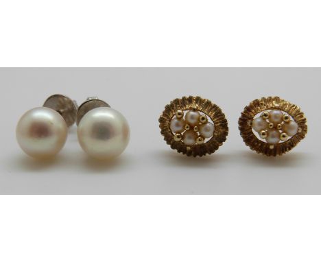 A pair of yellow metal earrings set with pearls and a pair of 18ct white gold earrings set with a pearl to each 