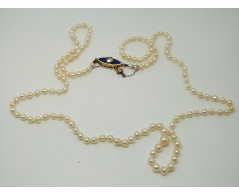A Victorian graduated pearl necklace with blue guilloché enamel clasp set with a rose cut diamond 