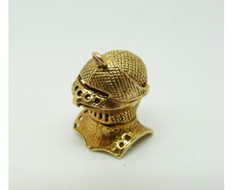 A 9ct gold charm in the form of a knight's helmet, 6g