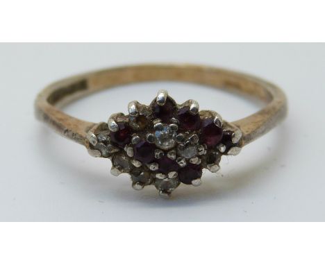 An 9ct gold ring set with rubies and diamonds (size R) 