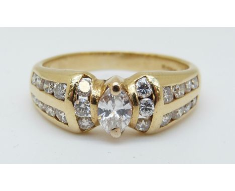 A 14ct gold ring set with a marquise cut diamond surrounded by round cut diamonds, 4.19g (size K) 