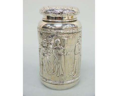 A German silver tea caddy with import marks for Chester 1905 and relief moulded decoration of figures in classical attire att