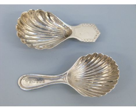 Two hallmarked silver caddy spoons of shell form, one Chester 1910, maker HF, length 7cm the other Birmingham 1915 maker's ma