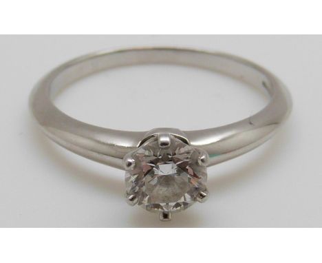 A Tiffany & Co platinum ring set with a round brilliant cut diamond of approximately 0.74ct (size N)