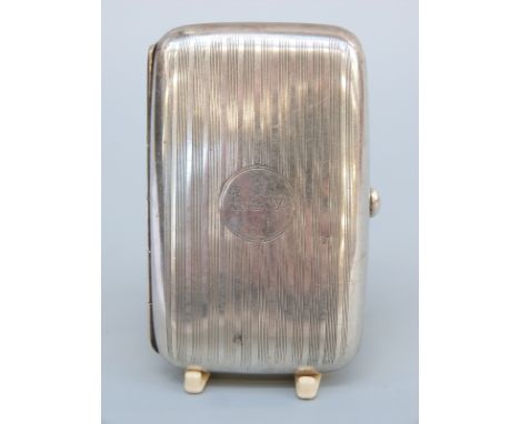 A George V hallmarked silver cigarette case with engine turned decoration, Birmingham 1935, weight 49g 