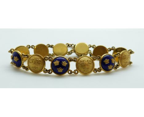 A Swedish gilt bracelet set with circular links depicting three crowns to each with alternating blue enamel ground 