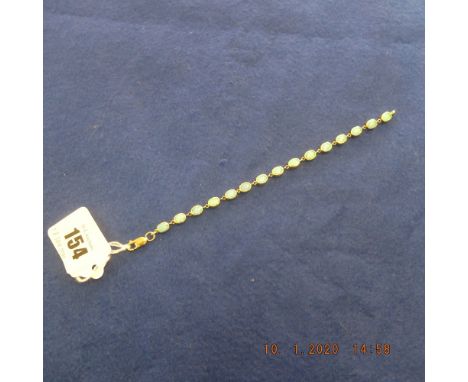 A 9ct gold and opal line bracelet