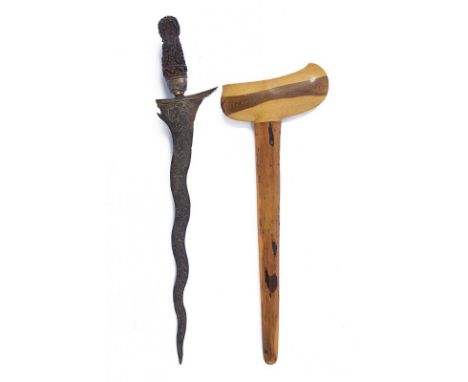 dating: circa 1900 provenance: Giava, Undulated double-edged blade, in pamor, with slightly chiselled base. Wooden ukiran, ri