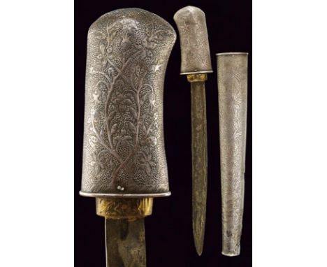 dating: Late 19th Century provenance: Giava, Single-and false-edged blade, in pamor. Grip covered with silver foil, engraved 