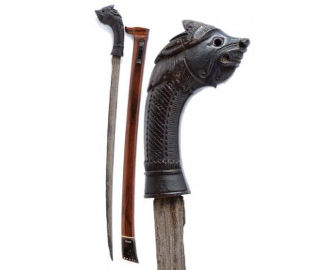 dating: 20th Century provenance: Sumatra, Single-edged, slightly curved blade, in pamor. Wooden grip, embossed with a dragon'