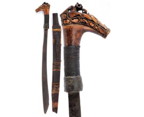 dating: Late 19th Century provenance: Kalimantan, Single-edged blade, of typical shape. Bone grip, richly embossed, base with