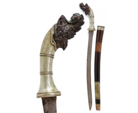 dating: circa 1900 provenance: Sumatra, Curved, single-edged blade, in pamor. Horn hilt, richly embossed with floral motifs. 