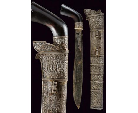 dating: 19th Century provenance: Sulawesi, Single-edged blade, in fine pamor. Wooden grip with ring-nut in silver foil, embos