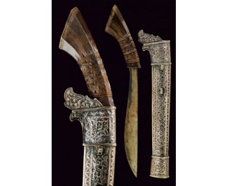 dating: 19th Century provenance: Sumatra, Wide, single-edged blade, in pamor. Horn, richly embossed grip. Scabbard completely