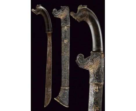 dating: 19th Century provenance: Sumba, Straight, single-edged blade, in fine pamor. Horn grip, embossed with a dragon's head