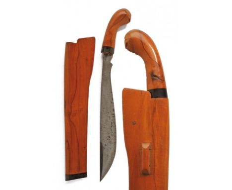 dating: 20th Century provenance: Borneo, Wide, single-edged blade, chiselled at the base. Wooden grip and scabbard with horn 