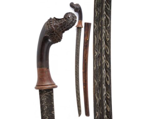 dating: early 20th Century provenance: Sumatra, Curved, single-and false-edged blade, in fine pamor, with double groove. Wood