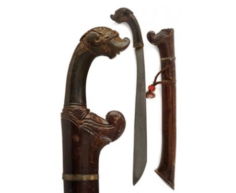 dating: 19th Century provenance: Sumatra, Heavy and wide, single-edged blade, in pamor. Horn grip, embossed with a monster's 