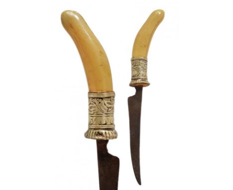 dating: Mid 19th Century provenance: Sumatra, Short, single-edged blade. Ivory grip with silver ring-nut, engraved with flora