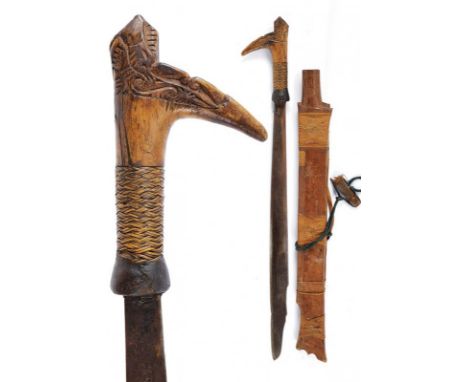 dating: circa 1900 provenance: Kalimantan, Single-edged blade, of typical shape. Wooden hilt, slightly embossed, base with ve