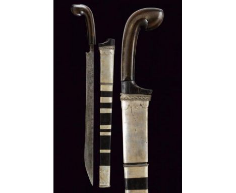 dating: 19th Century provenance: Sumatra, Straight, single-edged blade, with curl at the base and narrow tang. Horn, embossed