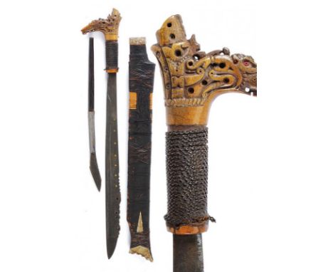 dating: 20th Century provenance: Kalimantan, Single-edged blade of typical shape, chiselled and pierced on the back near the 