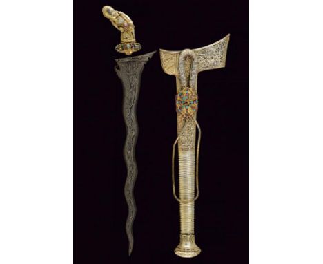 dating: 19th Century provenance: Sulawesi, Undulated double-edged blade, in fine pamor, with wide base and curl. Ukiran and s