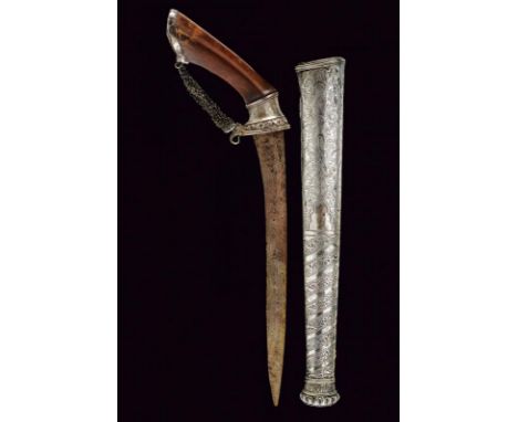 dating: 19th Century provenance: Giava, Single-and false-edged blade, in pamor. Angled, wooden grip with silver mounts, embos