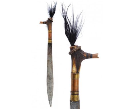 dating: circa 1900 provenance: Kalimantan, Heavy, single-edged blade, of typical shape, with battle notch. Deer horn grip, em