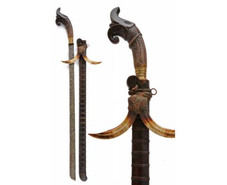 dating: 19th Century provenance: Nias, Long, single-edged blade. Wooden grip, embossed, with brass ring-nut. Wooden scabbard 