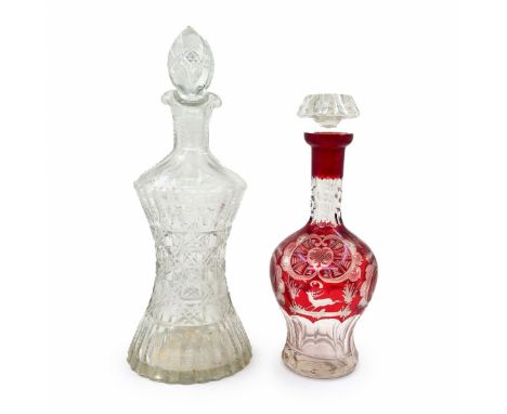Two Antique Decanters, the large one is made of transparent crystal, Width: 14 cm, Height: 33.5 cm. And another decanter made