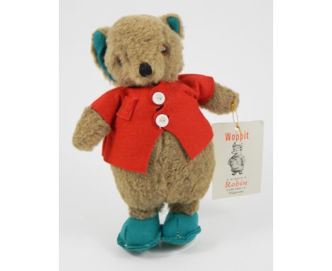 A rare Merrythought ‘Mr Woppit’ Teddy Bear with original card label, English circa 1956, The light brown character bear with 