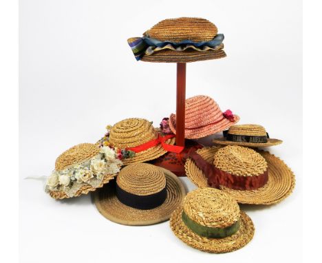 Collection of dolls bonnets, including twelve straw bonnets and boaters, woollen bobble hat, knitted beret and scarf, baby bo