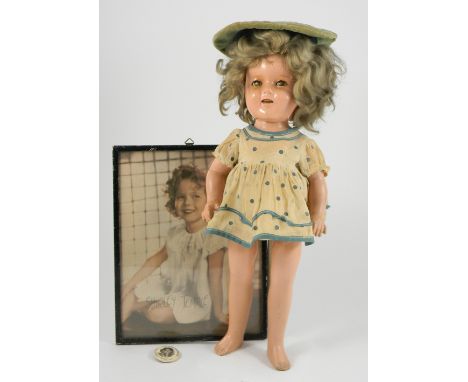 Composition ‘Shirley Temple’ doll, probably Ideal, American 1930’s, with weighted green eyes, (crazed), open mouth with teeth