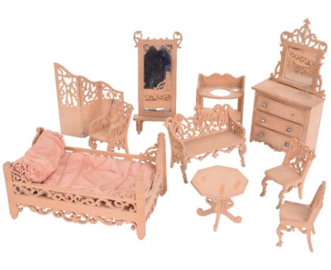 Fretwork wooden bedroom furniture, circa 1915, including bed with original pink satin bedding, two chairs, one arm chair, (sl