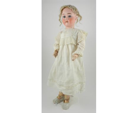 Max Handwerck bisque head doll, Germany circa 1910, with fixed blue glass eyes, open mouth with upper teeth, original blonde 