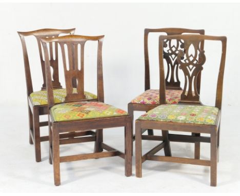 Two pairs of Georgian provincial Chippendale style mahogany side chairs, each with a differing gross-point needlework drop in