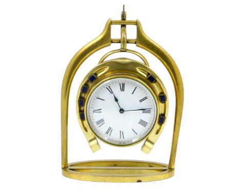 Novelty brass equestrian mantel clock, having a circular white enamelled dial with Roman numerals encased within a horseshoe 