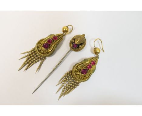 Pair of Victorian pinchbeck and garnet pendant earrings, circa 1870, centred with three oval cut garnets in leaf form, with w