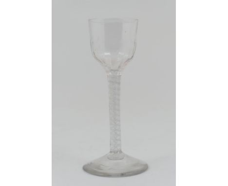 George III opaque twist wine glass, circa 1765, ogee bowl with flute moulded base, over a stem with four ply spiral band outs