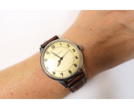 Jaeger Le Coultre stainless steel gent's wristwatch, circa 1945, 28mm champagne coloured dial with Arabic numerals, centre sw