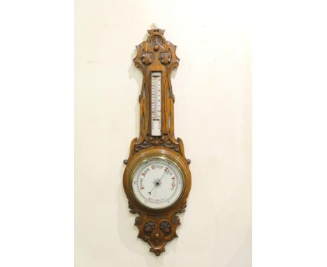 Victorian carved oak aneroid barometer, in the Art Nouveau style, circa 1900, printed pottery dial, 20cm, beneath a damaged c