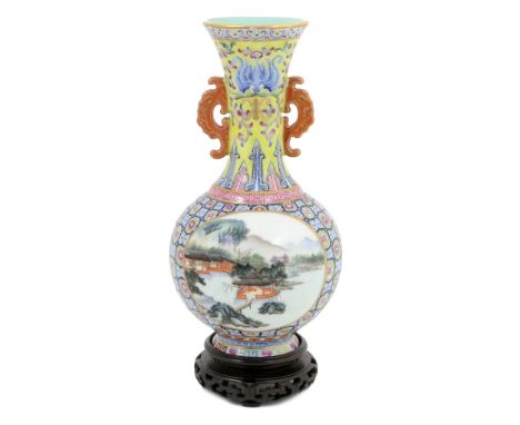 Chinese landscape vase, 20th Century, baluster form decorated with two river landscape panels against a famille rose floral d