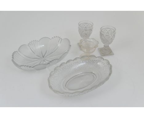 Early 19th Century cut glass bowl, with fan and strawberry cutting, 25.5cm; also a further cut glass oval bowl with fan cut b