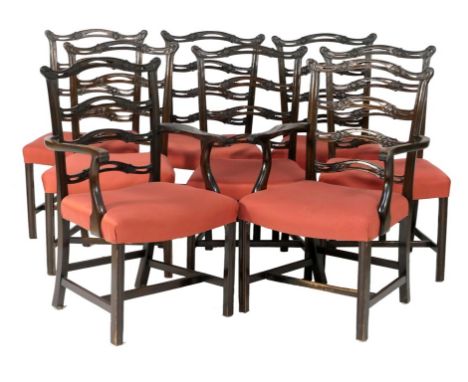 Set of eight Chippendale style mahogany dining chairs, with wavy ladder backs and stuffover seats, on ogee moulded forelegs